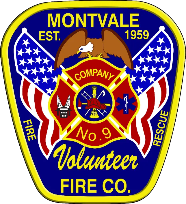 A badge-shaped logo with a yellow border and blue background. The text reads "Montvale Volunteer Fire Co." with "Est. 1959" at the top. The logo features an eagle, American flags, and various firefighting symbols, including a hydrant, ladder, and helmet.